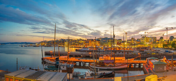 Oslo cityscape at night with view of Port in Oslo city, Norway.