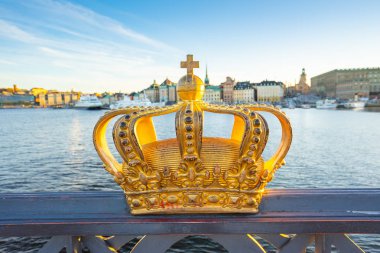 Golden Crown on the Skeppsholmen Bridge in Stockholm, Sweden clipart