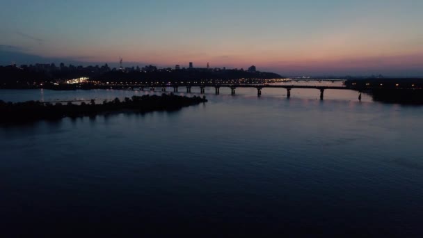 Aerial footage. Fly to Kyiv bridge at evening — Stock Video