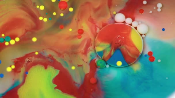 Abstract multicolored bubbles paint. Slow motion. Top view — Stock Video