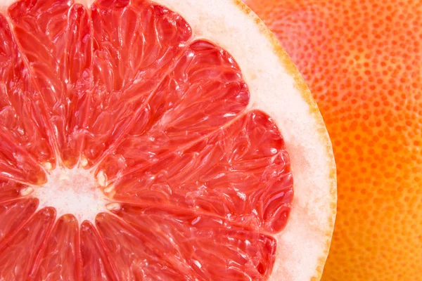 Draufsicht Auf Eine Hälfte Frischer Zitrusgrapefruit Als Nahrungsmittelhintergrund — Stockfoto