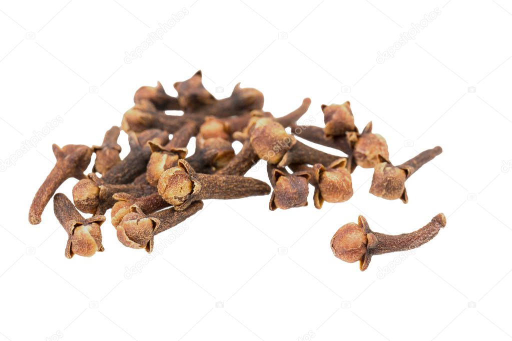 A heap of dried cloves spice on a white background