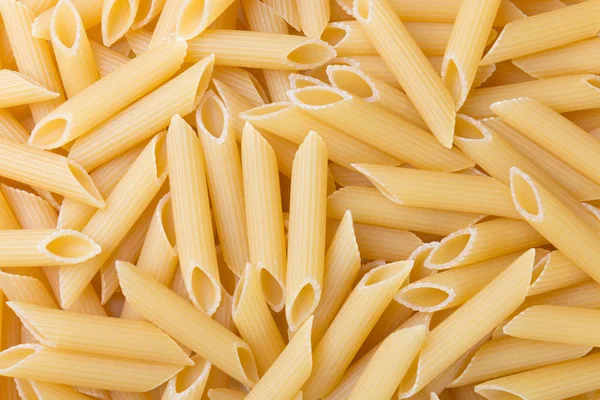 Pennoni okokt full Korns vete Penne pasta. Mat bakgrund. — Stockfoto