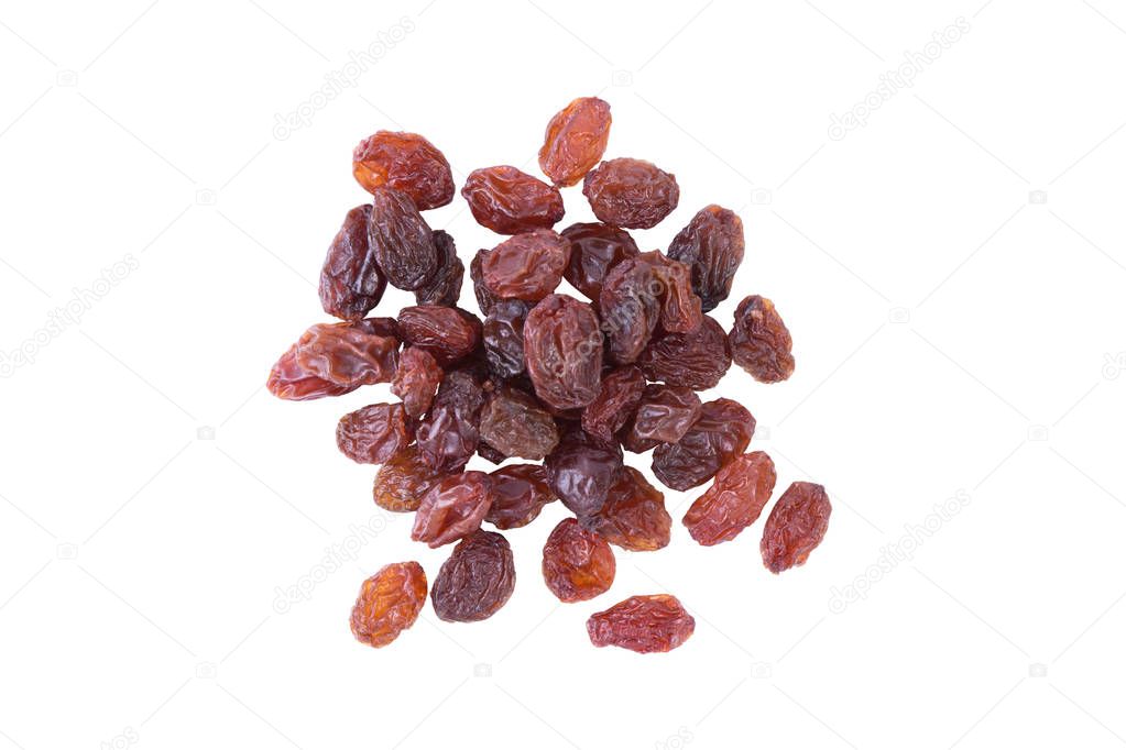 Dried black raisins on white. Fruit background.