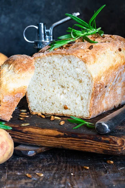Home baked potato bread on rustic wooden table