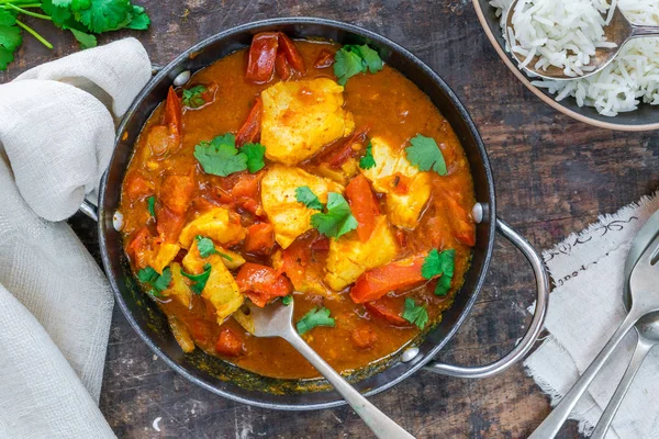 Fish Mappas - Kerala style coconut fish curry with rice. It\'s a popular dish in southern Indian state of Kerala. Top view