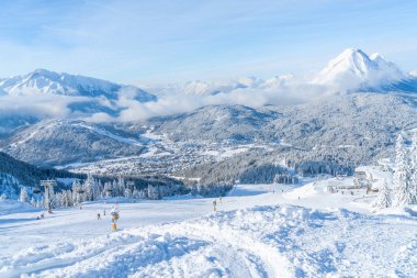 SEEFELD, AUSTRIA - JANUARY 11, 2019: People enjoy skiing on slopes in Seefeld, well known for it's winter sports centres and amongst the most popular tourist resorts in Austria.
