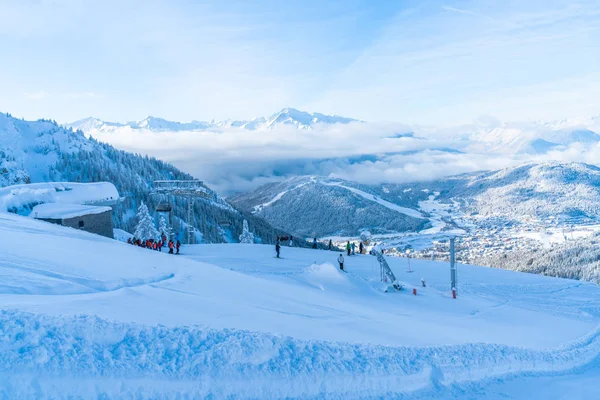 SEEFELD, AUSTRIA - JANUARY 11, 2019: People enjoy skiing on slopes in Seefeld, well known for it's winter sports centres and amongst the most popular tourist resorts in Austria.