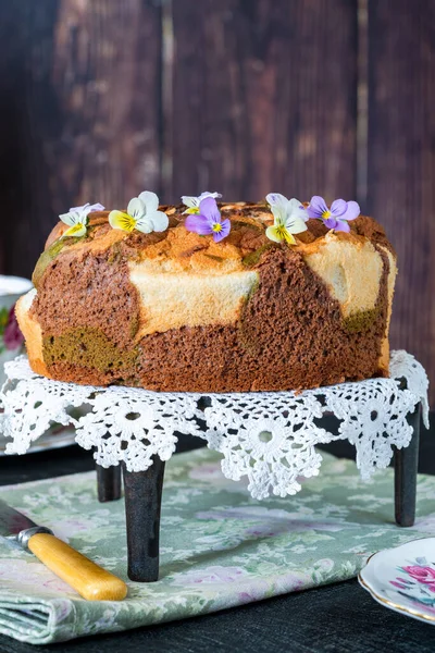 Camouflage chiffon cake with matcha decorated with eadible viola flowers