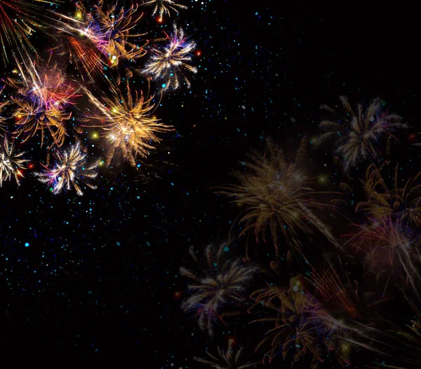 Abstract gekleurde vuurwerk achtergrond. Nieuwjaarsachtergrond. — Stockfoto