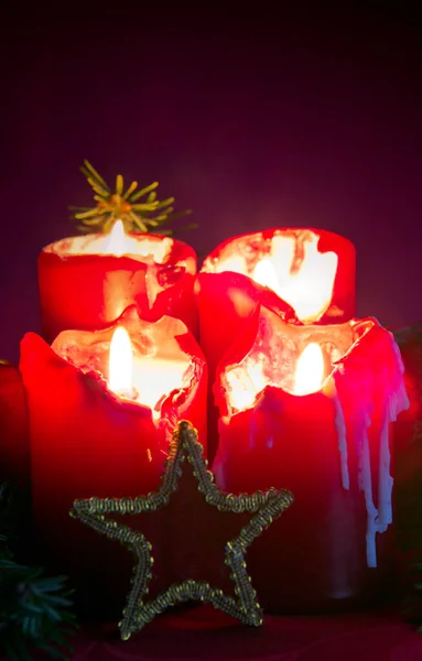 Four red burning Advent candles and decoration. . Christmas background. — Stock Photo, Image