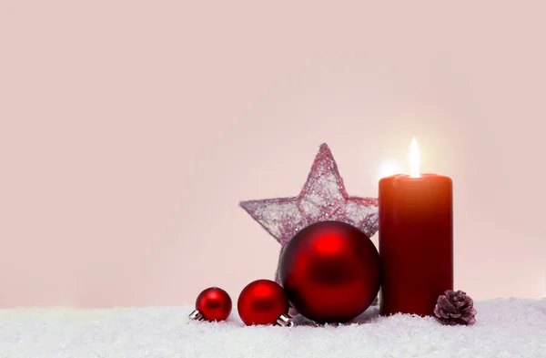 Christmas background with Advent candle and red decoration. — Stock Photo, Image