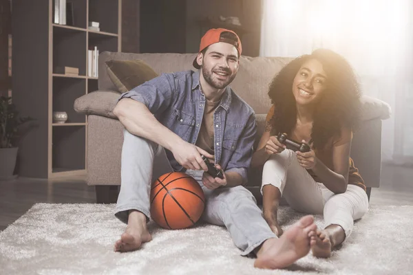 Positive romantic guy and girl are resting at home — Stock Photo, Image