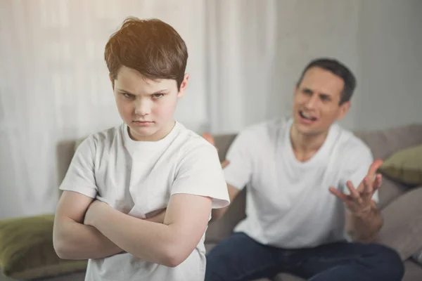 Offended child hearing irritated dad shouting — Stock Photo, Image