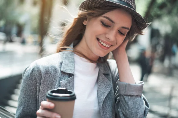 Cheerful pretty lady enjoying hot drink — Stock Photo, Image