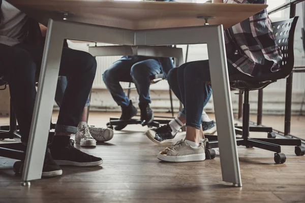 Colleagues sitting at desk during labor