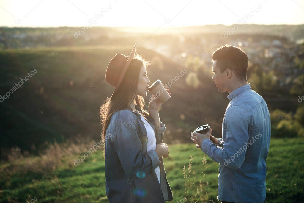 Man and woman relaxing in evening nature