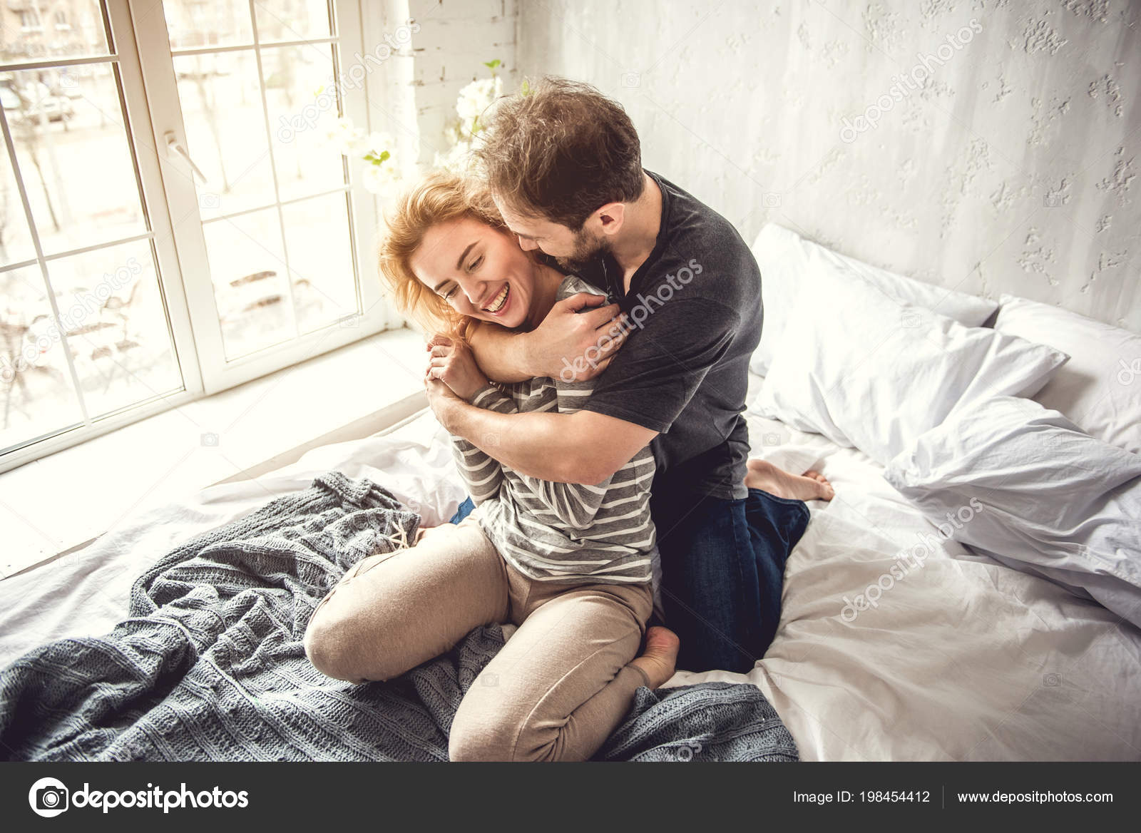 Man is hugging tightly beloved woman - Stock Photo, Image. 