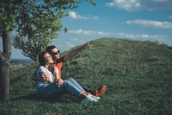 Young male and female admiring summer days together