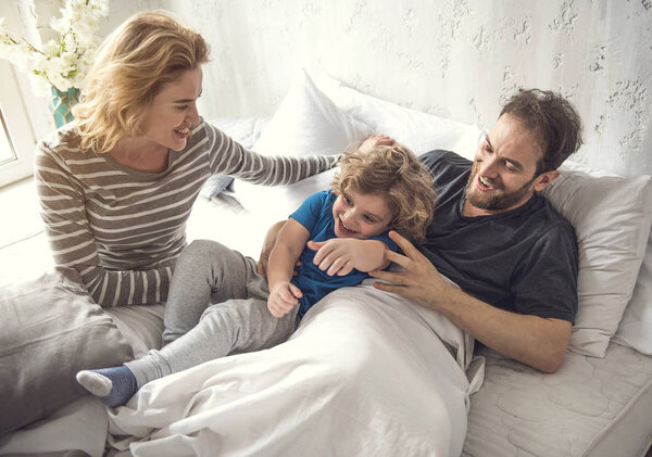 Cheerful family are enjoying morning time together