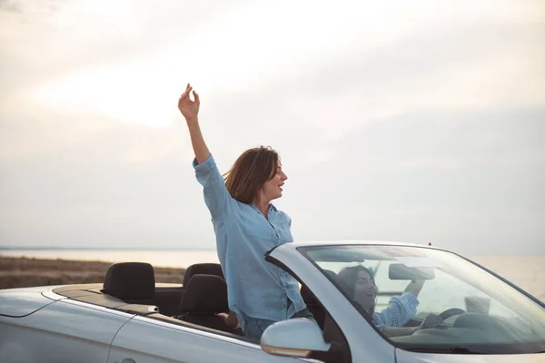 Positive attractive women are driving auto — Stock Photo, Image