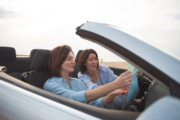Cheerful girls are driving car — Stock Photo, Image