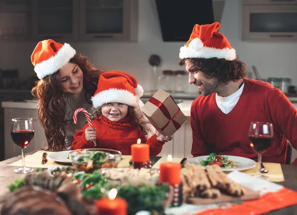 Joyful parents and daughter enjoying New Year celebration — Stock Photo, Image