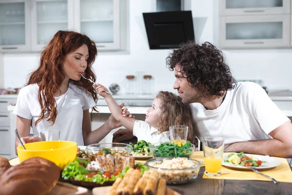 Joyful family having lunch together at home — Stock Photo, Image