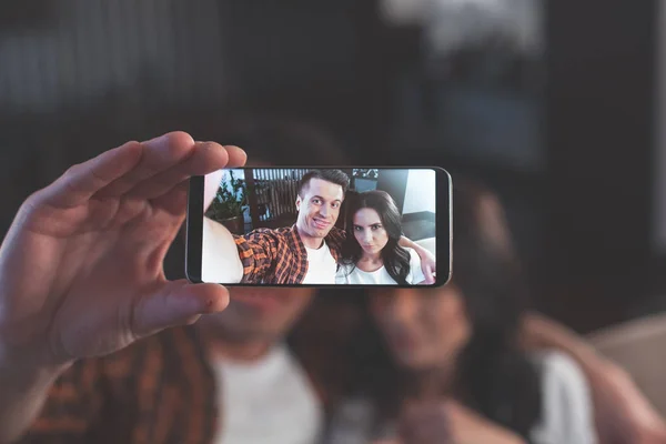 Carefree couple making selfie and having fun