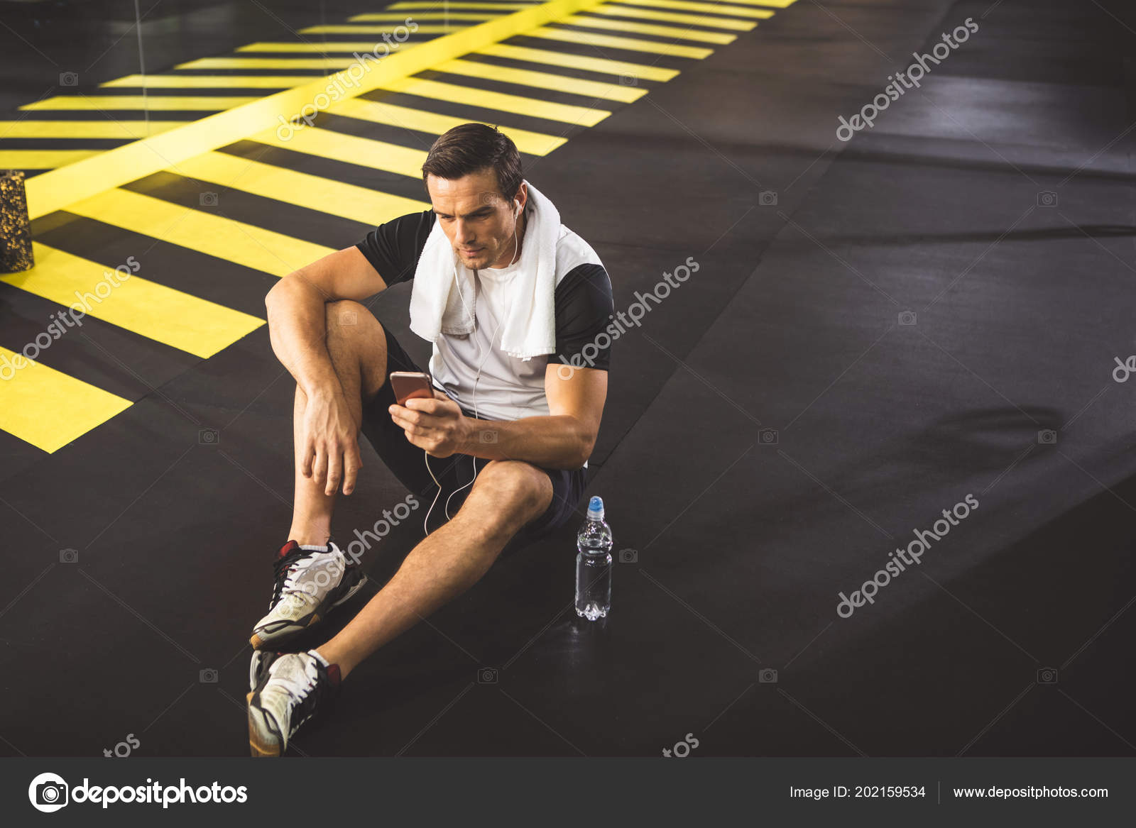 Orderly Man Hearing Song In Headsets Stock Photo C Iakovenko123