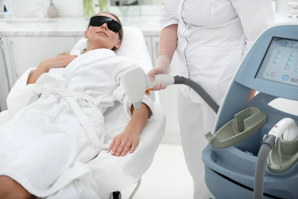 Positive Female Patient Locating Coach While Getting Depilation Special Equipment — Stock Photo, Image