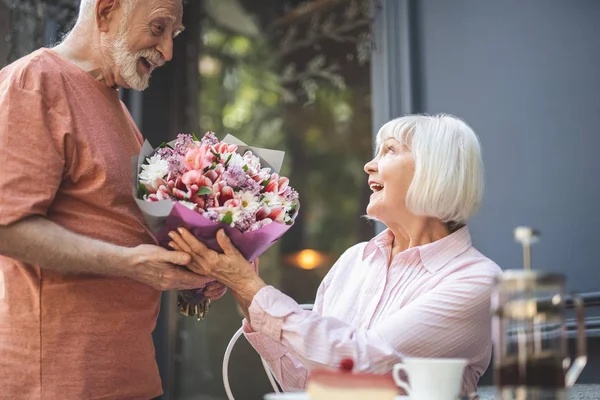 Delighted couple happy to meet outside