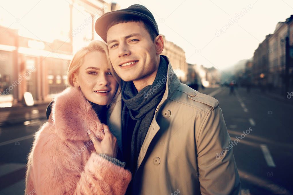 Beautiful young couple hugging on the street