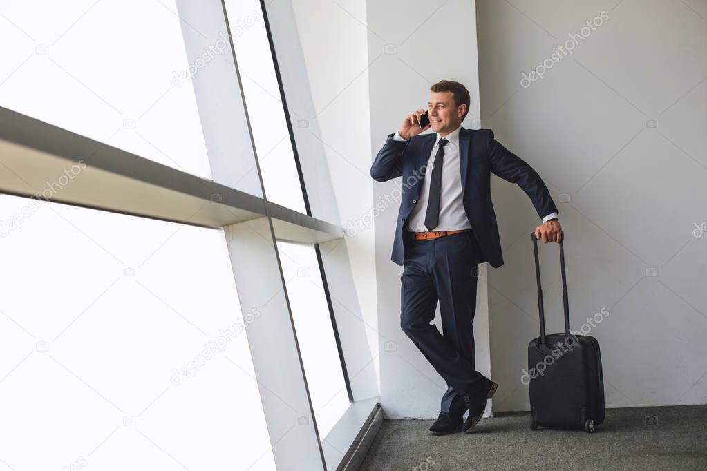 Happy man getting assignment for necessary trip