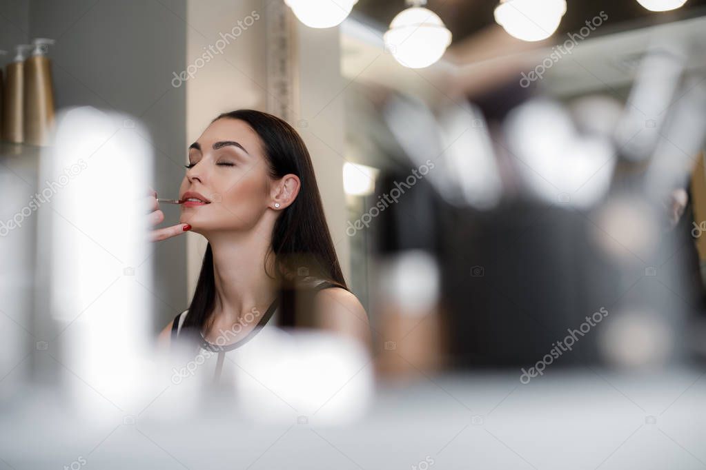 Charming young lady waiting for amazing makeup