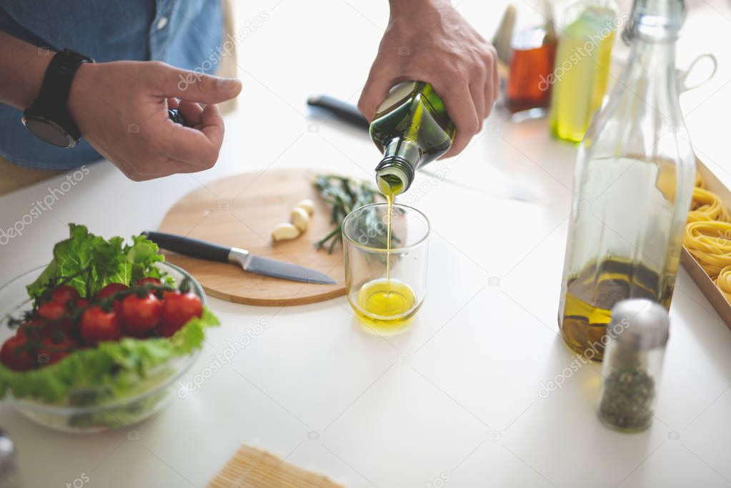 Man preparing ingredients for vegetable salad