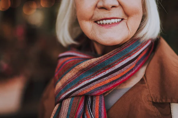 Old lady expressing joy on blurred background — Stock Photo, Image