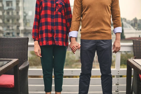 Young couple is locating on light terrace — Stock Photo, Image