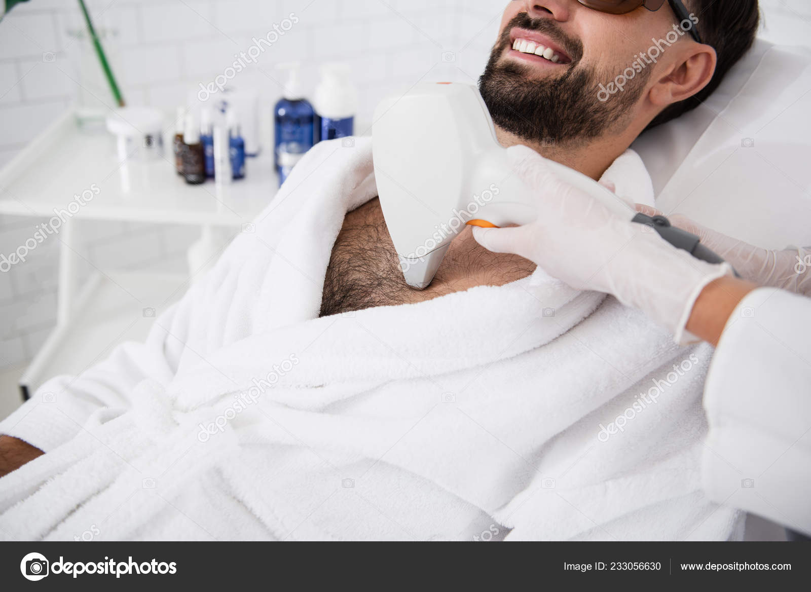 Close up of hand with laser hair removal on hairy male chest Stock Photo by  ©iakovenko123 233056630