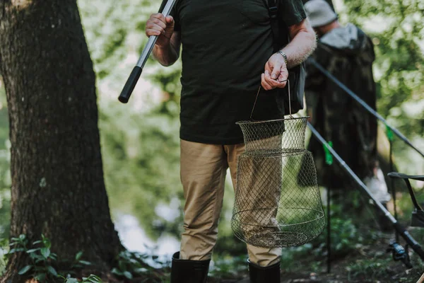 Close up of a net in hands of a fisherman — Stock Photo, Image