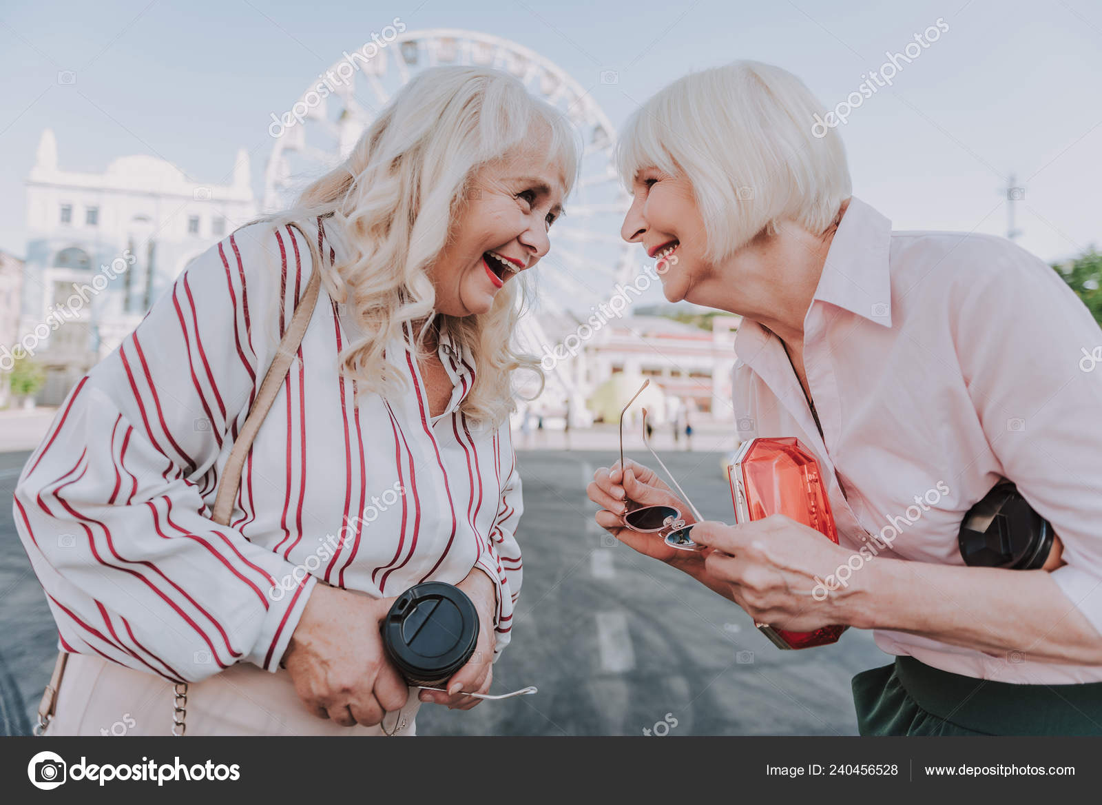 Two Laughing Older Women Are Staying On Square Stock Photo