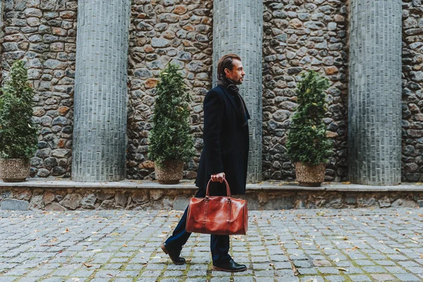 Trendy male is walking along beautiful boulevard — Stock Photo, Image