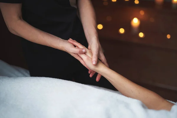 Young lady have relaxing massage of hand — Stock Photo, Image