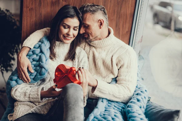 Tender couple celebrating family day at cafe