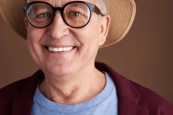 Happy smiling adult man close up photo against the brown background — Stock Photo, Image