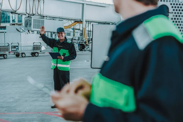 Two men from technical staff having job