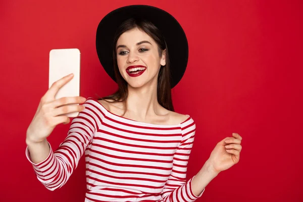 Happy cute girl making selfie at mobile phone — Stock Photo, Image