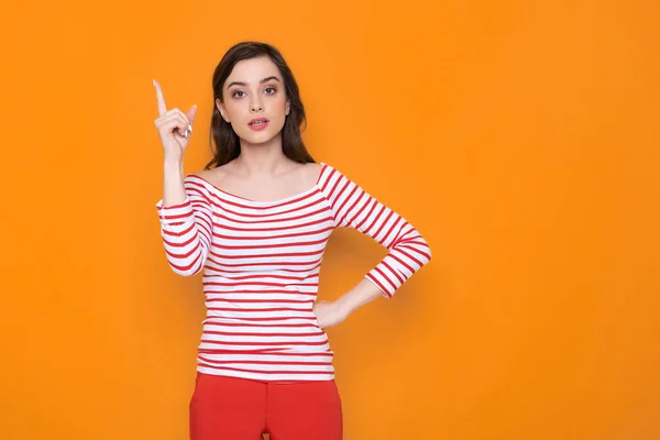 Waist up of serious brunette lady posing for camera in studio — Stock Photo, Image