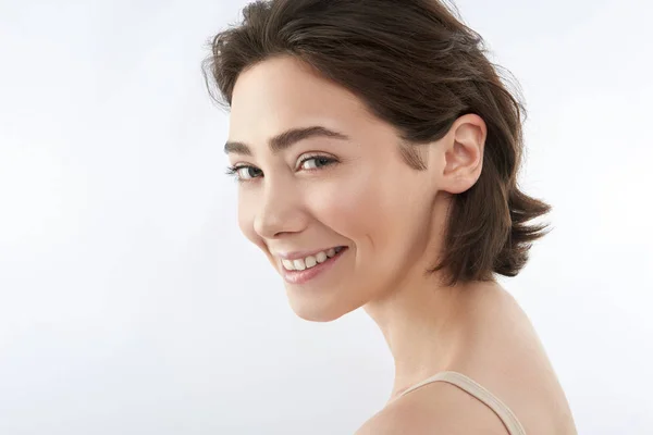 Seite auf von glücklich brünett weiblich auf weiß — Stockfoto