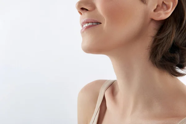 Low face of pretty brunette female on white — Stock Photo, Image